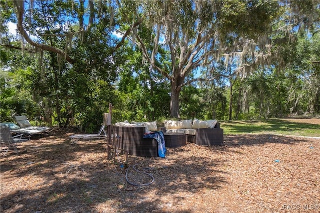 9093 E Pinehurst Ct, Inverness, FL 34450 - view of yard featuring outdoor lounge area