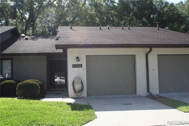 single story home featuring a garage