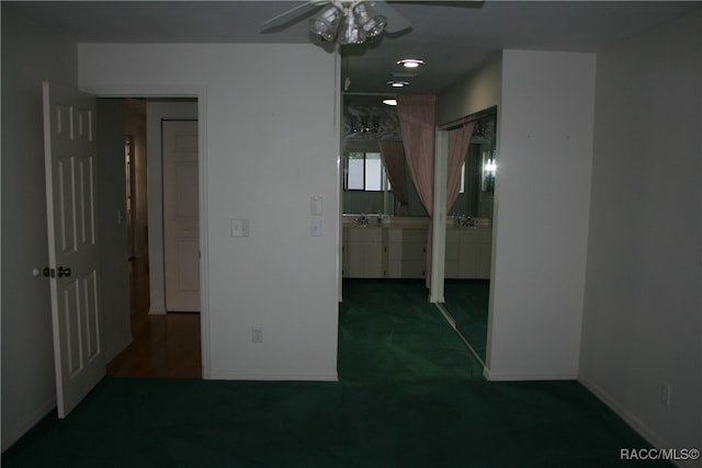 interior space featuring dark colored carpet