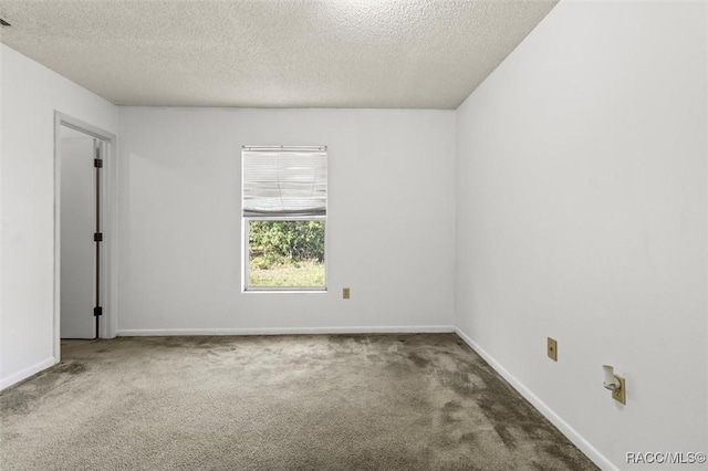 813 Constitution Blvd, Inverness, FL 34453 - spare room featuring baseboards, carpet flooring, and a textured ceiling