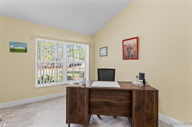 home office featuring vaulted ceiling