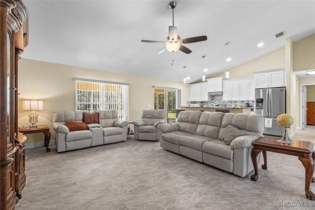 living room with high vaulted ceiling and ceiling fan