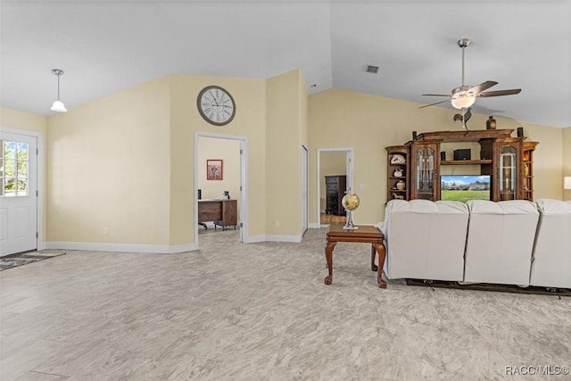 living room with ceiling fan and lofted ceiling