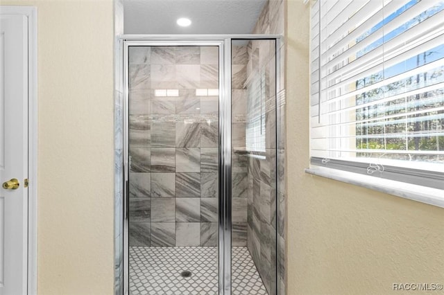 5886 W Pawnee Dr, Beverly Hills, FL 34465 - full bath featuring a shower stall and a textured wall