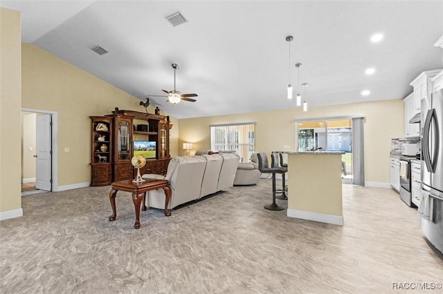 living room with vaulted ceiling and ceiling fan