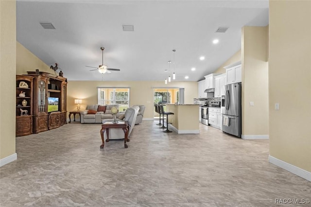 living room featuring high vaulted ceiling and ceiling fan