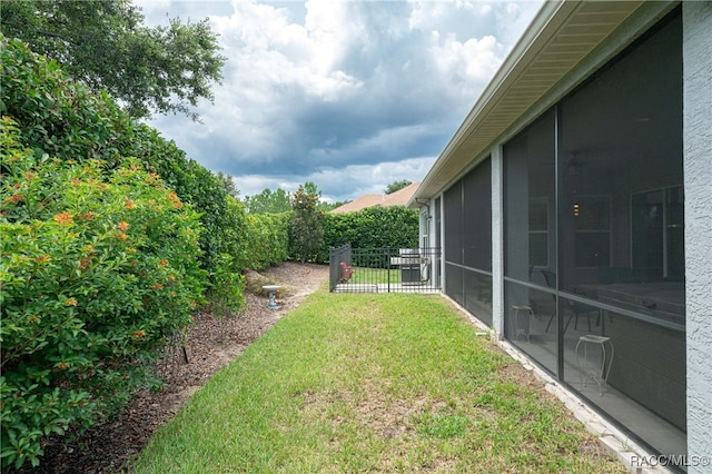 view of yard featuring a sunroom