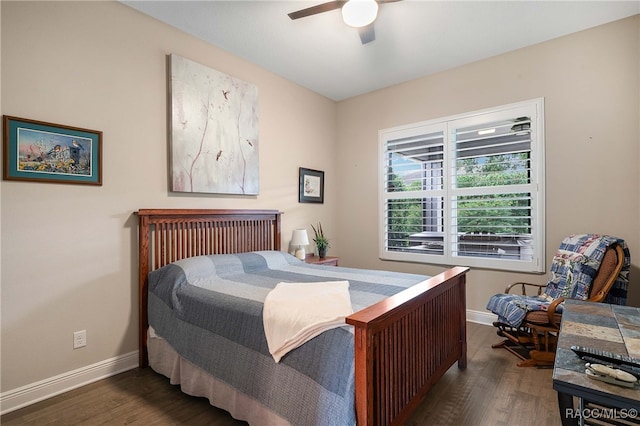 bedroom with ceiling fan and dark hardwood / wood-style flooring