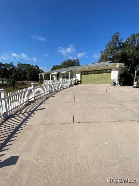 view of front of property featuring a garage