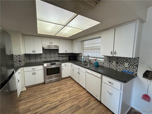 kitchen featuring sink, white cabinets, and stainless steel appliances