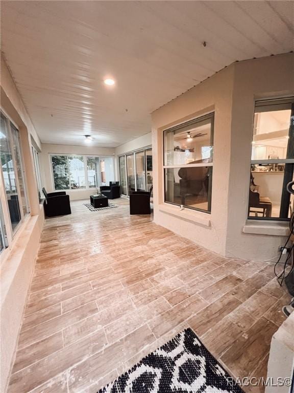 interior space featuring recessed lighting and wood finished floors