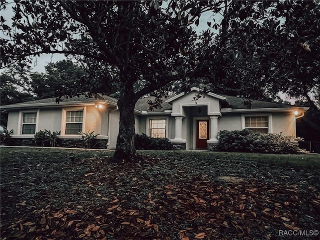ranch-style house with stucco siding