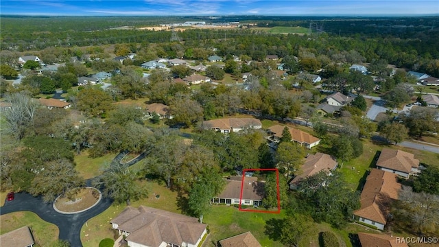 birds eye view of property with a residential view and a forest view