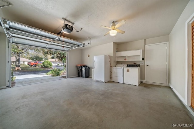 garage with ceiling fan, a garage door opener, freestanding refrigerator, and washer and dryer