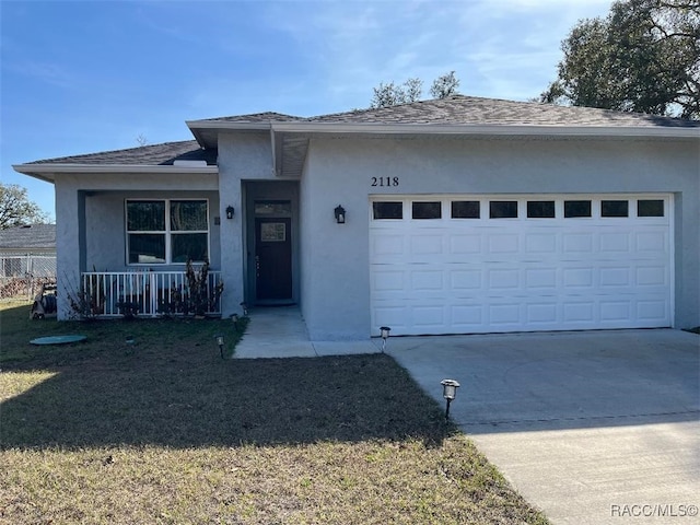 view of front of property featuring a garage and covered porch