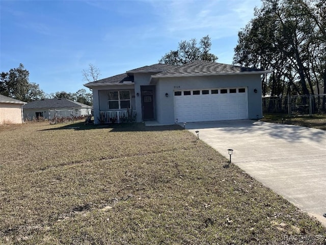 view of front facade with a garage and a front lawn