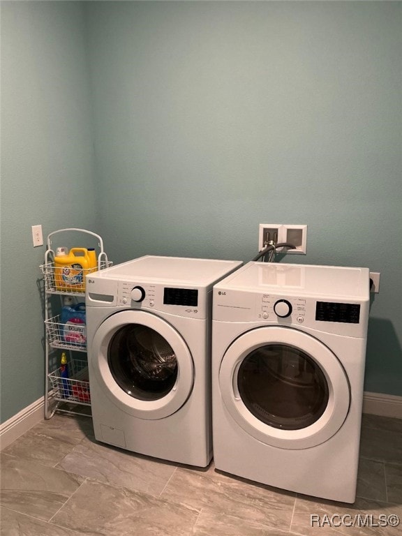 laundry area with washer and dryer