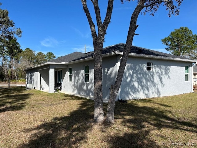 view of home's exterior with a yard