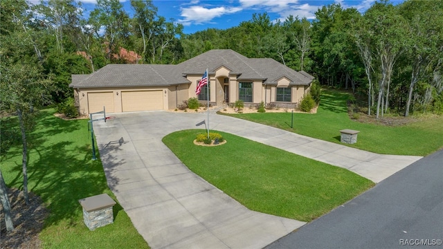 view of front of house with a garage and a front lawn