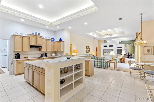 kitchen featuring light brown cabinetry, a raised ceiling, kitchen peninsula, and light tile patterned floors