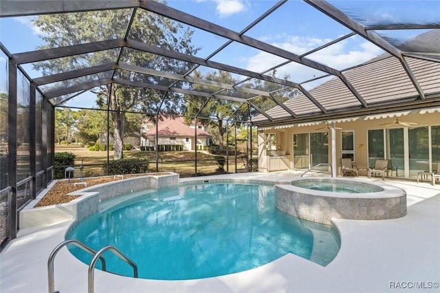 view of swimming pool featuring an in ground hot tub, a patio, ceiling fan, and glass enclosure