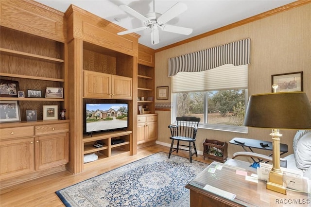 home office with ceiling fan, ornamental molding, built in features, and light hardwood / wood-style floors