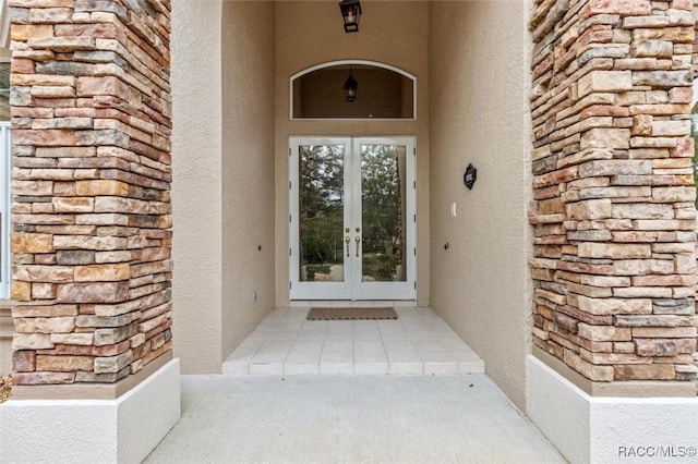 entrance to property featuring french doors