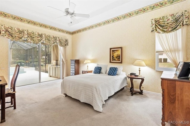 carpeted bedroom with cooling unit, access to exterior, and ceiling fan