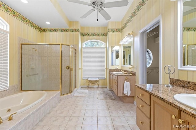 bathroom with vanity, ceiling fan, tile patterned flooring, and separate shower and tub