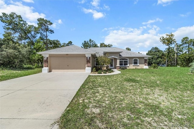 view of front facade with an attached garage, driveway, and a front lawn