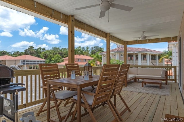 wooden terrace featuring outdoor lounge area and ceiling fan