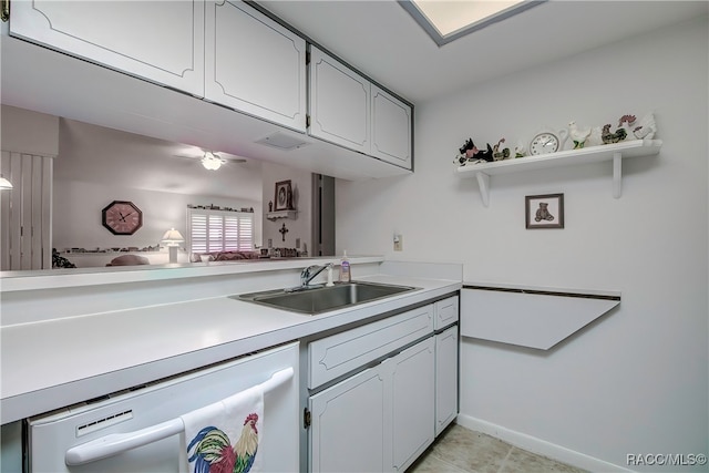 kitchen with white cabinets, dishwasher, and sink