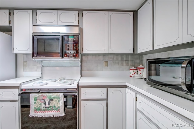 kitchen with backsplash, white cabinetry, and tile patterned floors