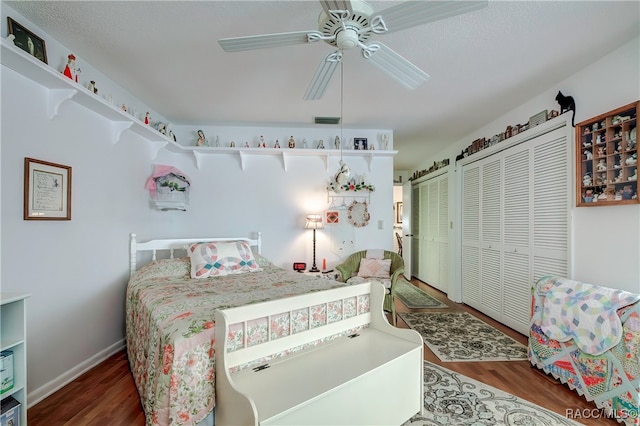 bedroom featuring dark hardwood / wood-style flooring and ceiling fan