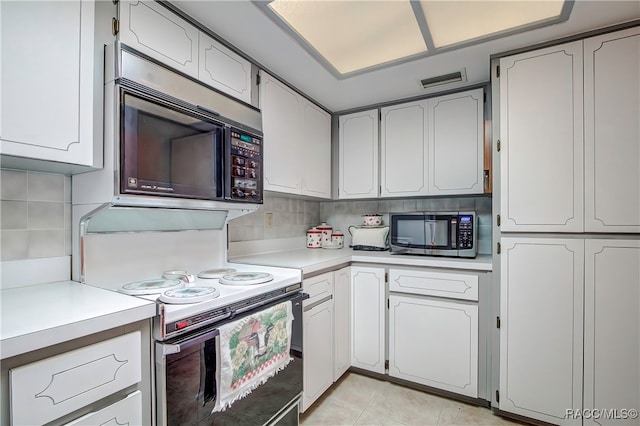 kitchen with white cabinets, electric stove, backsplash, and light tile patterned floors