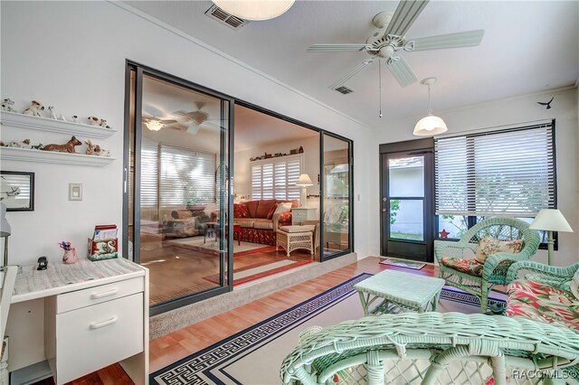 interior space with ceiling fan and hardwood / wood-style floors