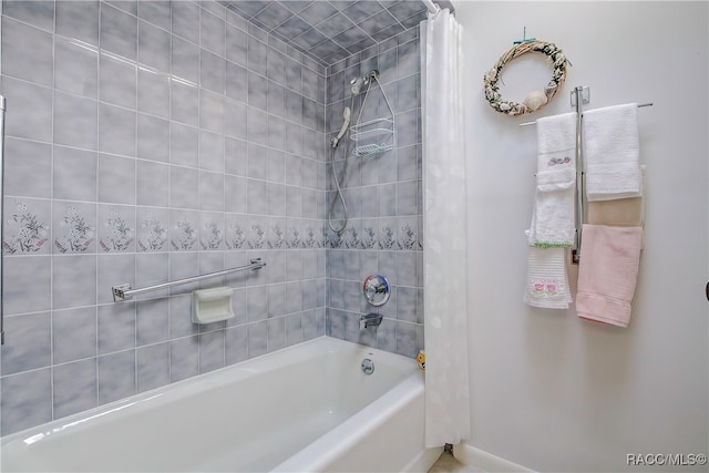 bathroom featuring shower / bathtub combination with curtain