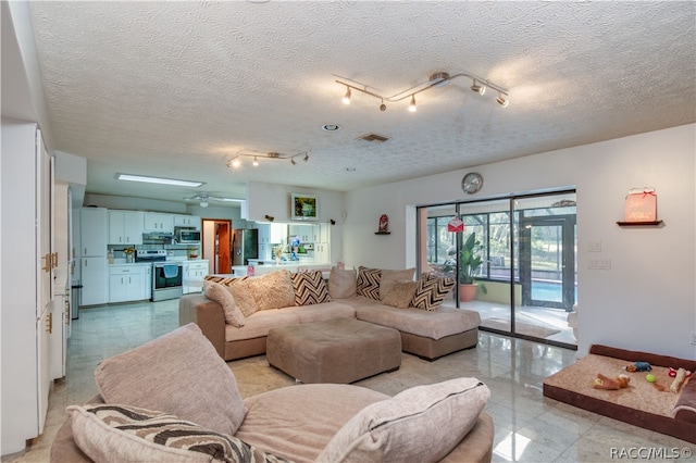 living room with a textured ceiling