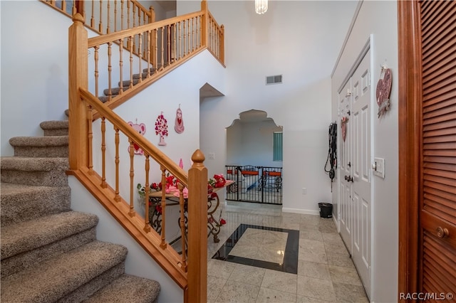 foyer entrance featuring a high ceiling