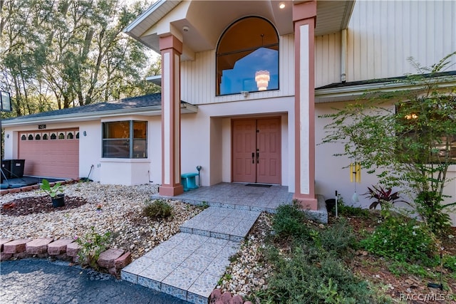 entrance to property featuring a garage