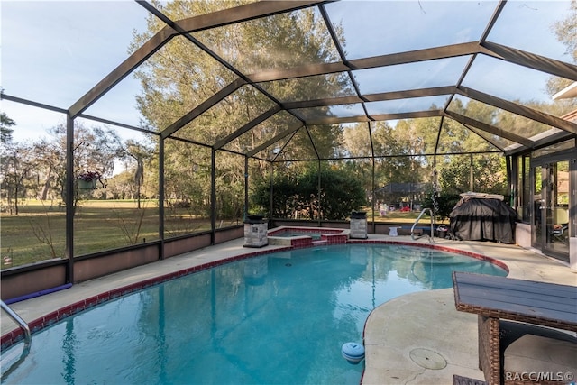 view of swimming pool with a lanai, an in ground hot tub, and a patio