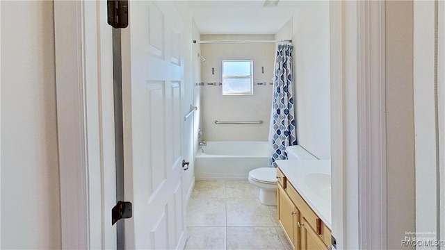 full bathroom with toilet, tile patterned floors, vanity, and shower / tub combo with curtain