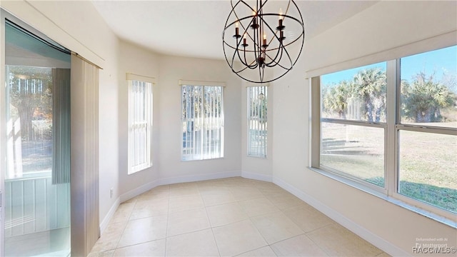 kitchen featuring white appliances, light tile patterned floors, and washer / dryer