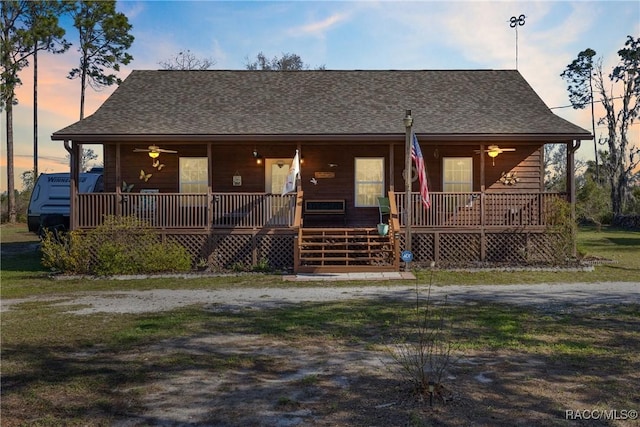 view of front of home featuring covered porch and roof with shingles