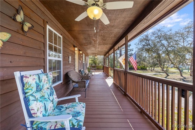 deck featuring a porch and a ceiling fan