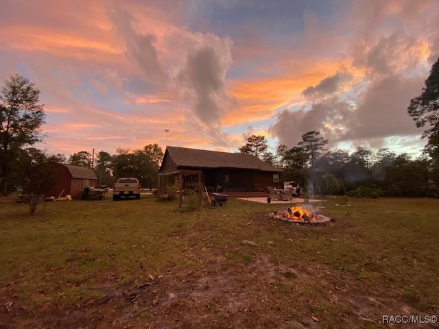 view of yard featuring an outbuilding and a patio area