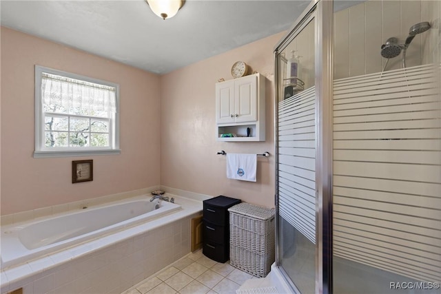 full bath featuring tile patterned floors, a stall shower, and a bath