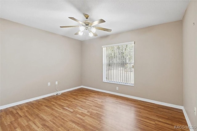 empty room with wood-type flooring and ceiling fan