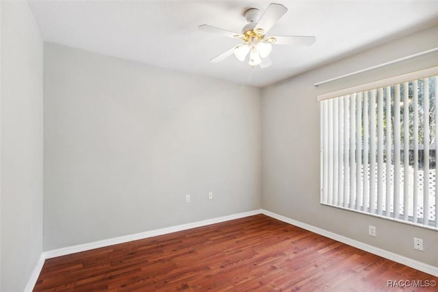 empty room featuring hardwood / wood-style flooring and ceiling fan