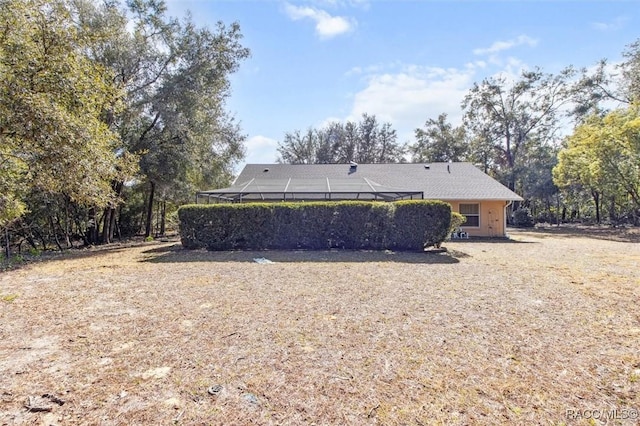 back of property with a lanai